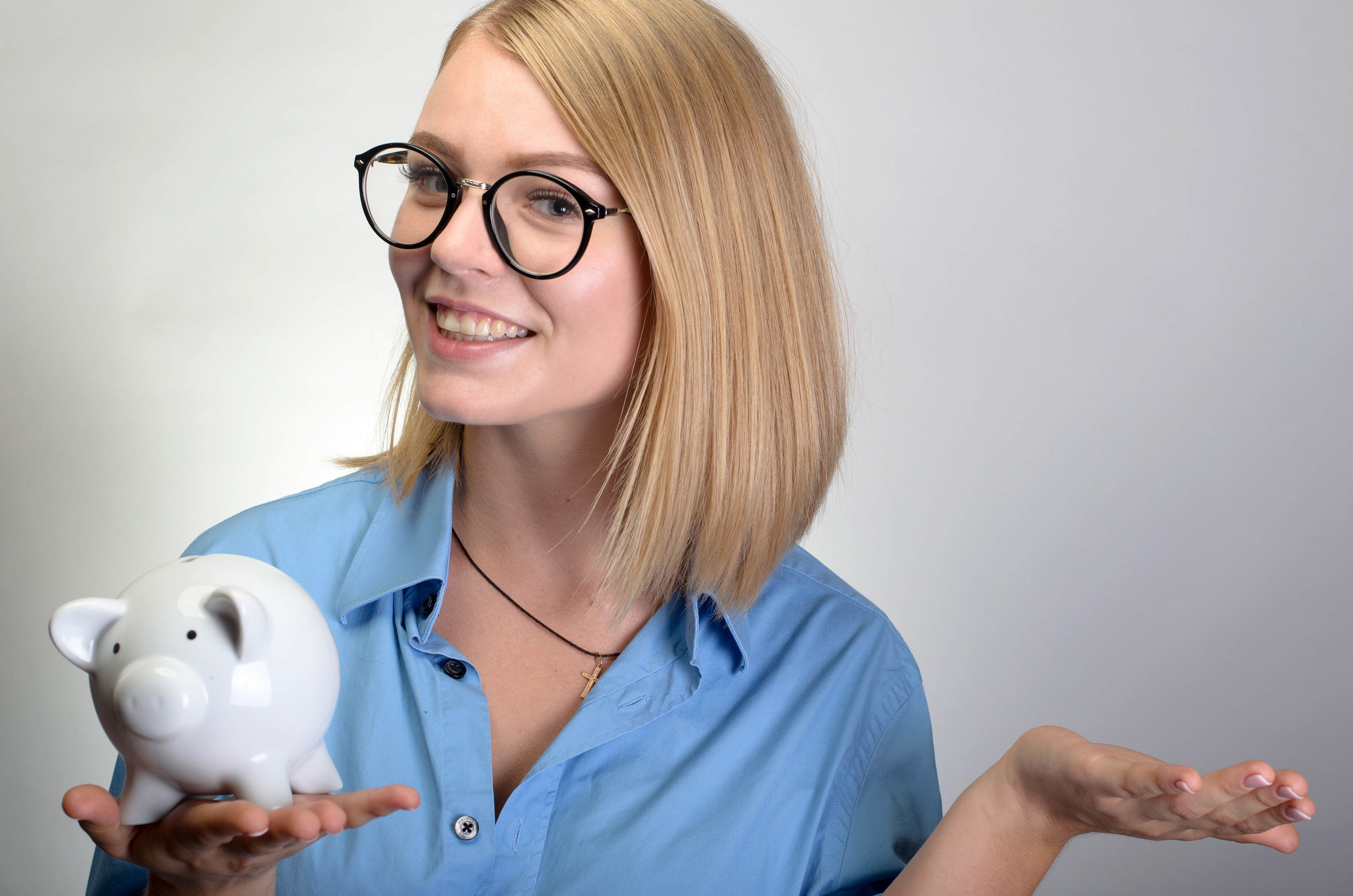 woman holding piggybank