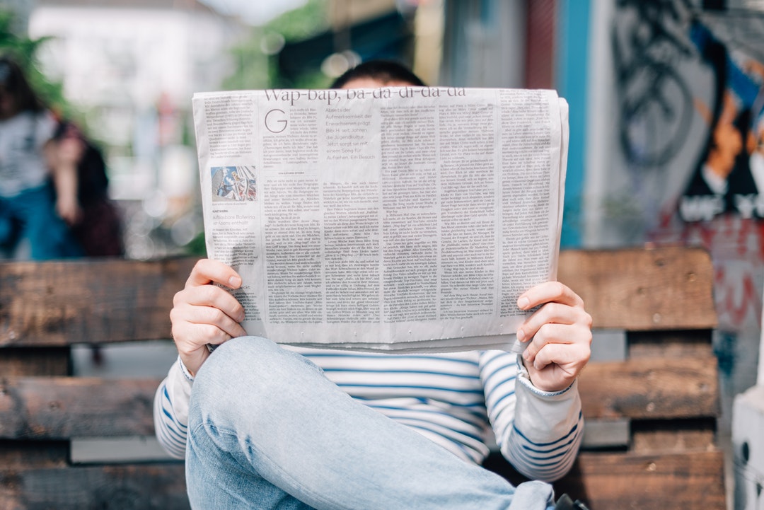 person reading news