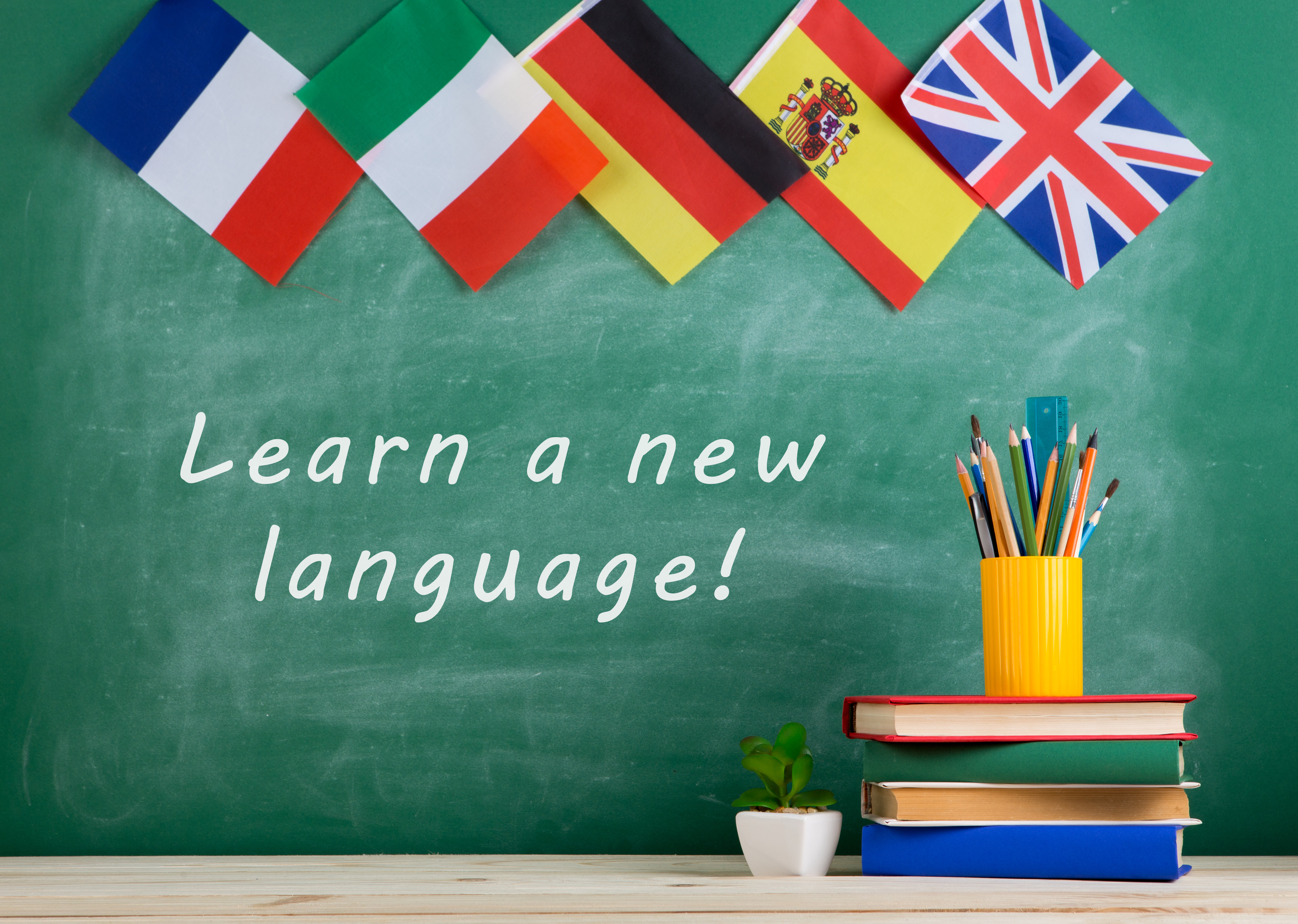 learn a new language written on chalkboard