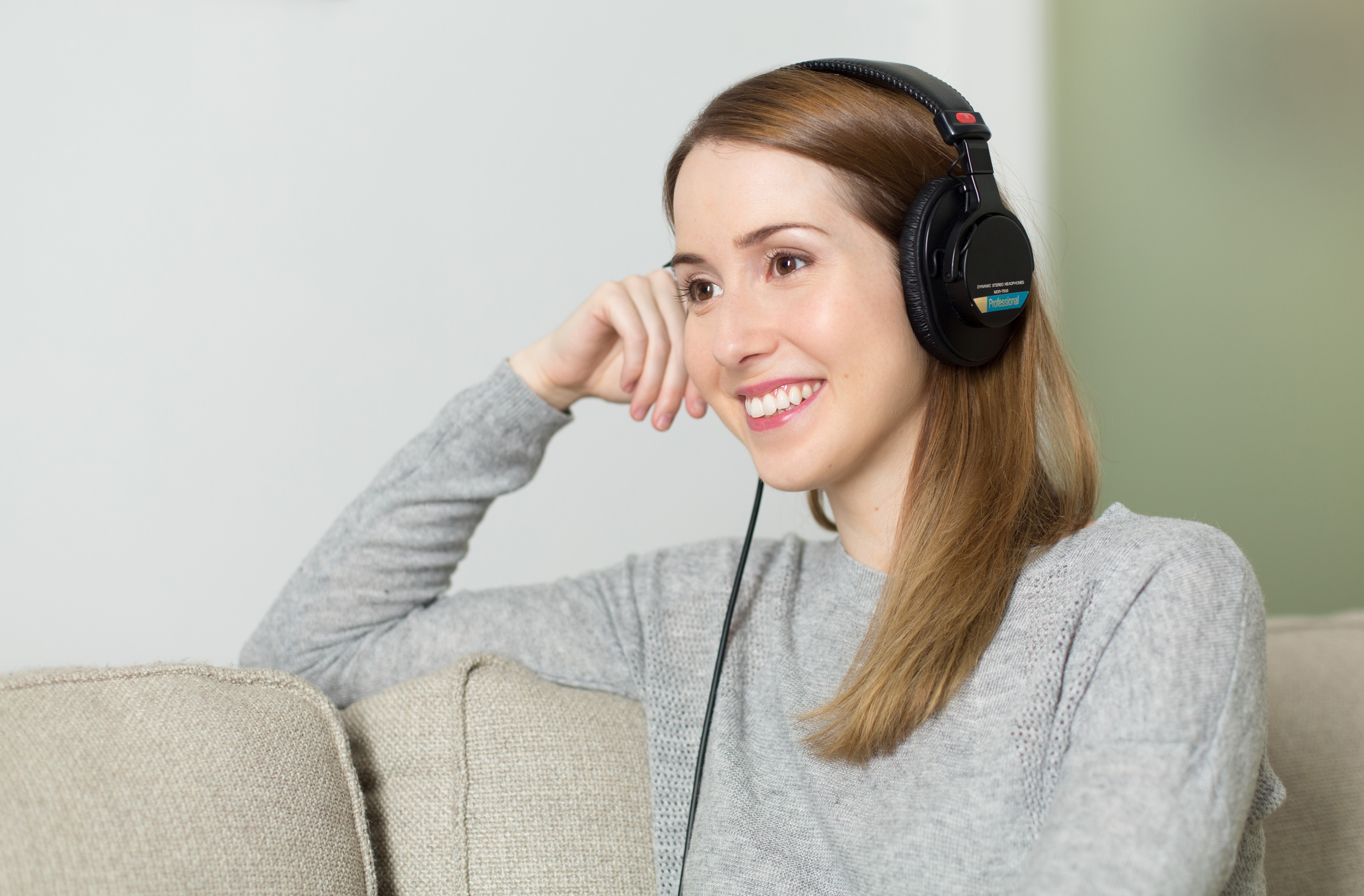 woman listening to music on headphones